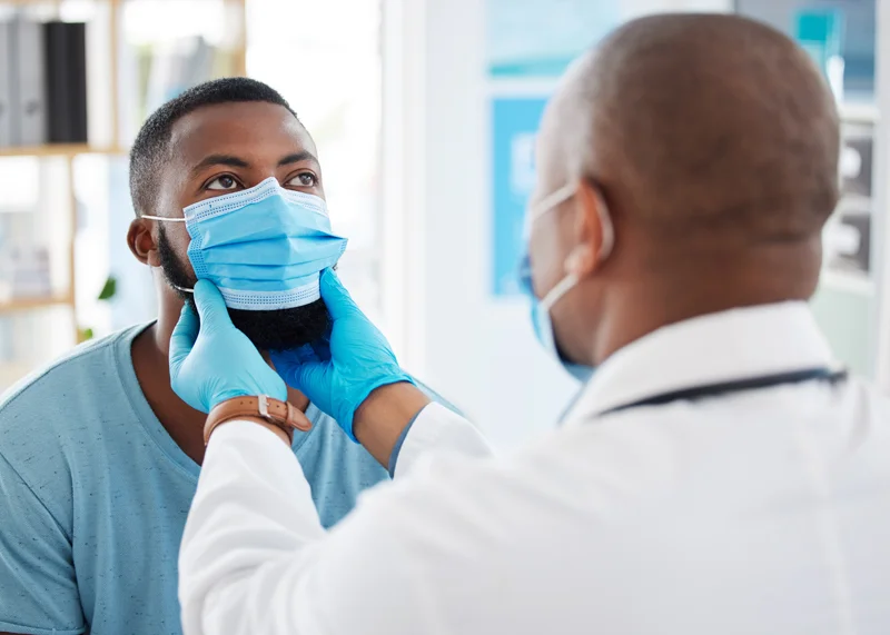 Doctor examining a patient during a clinical trials visit at Equity Medical in Nashville