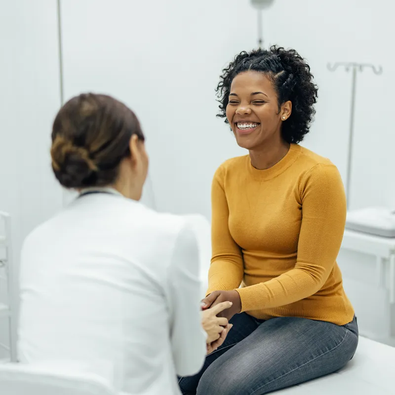 Woman meeting with a clinician during a clinical trials visit at Equity Medical in Nashville, Tennessee