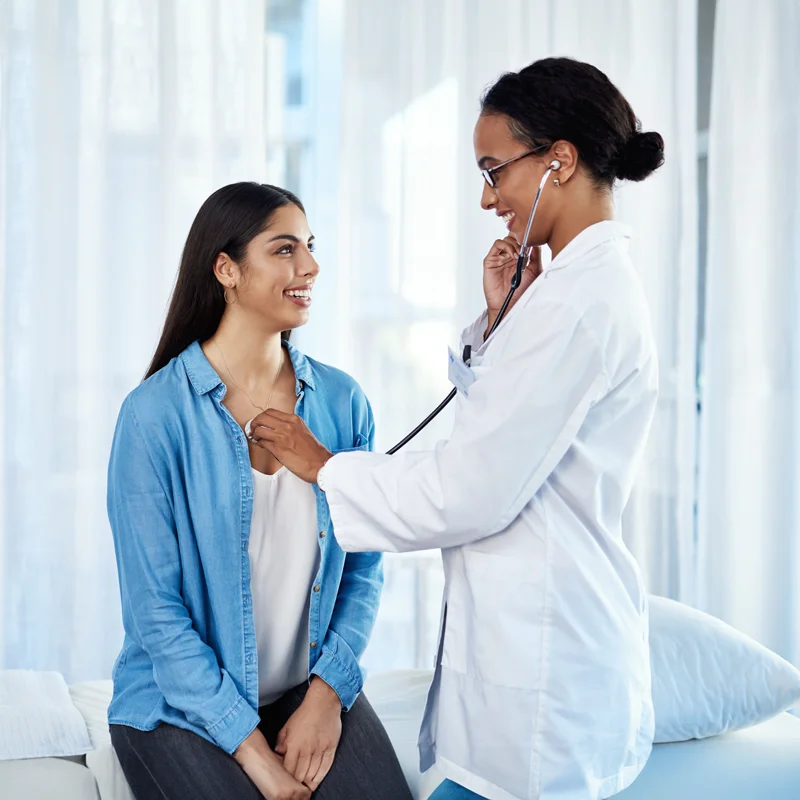 Doctor conducting a clinical assessment with a participant at an Equity Medical clinical trials research center