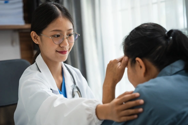 Physician supporting a patient through care and research at the Equity Medical Women’s Health Center of Excellence in Owensboro