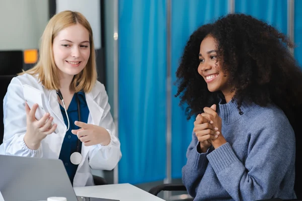 Doctor discussing women’s health clinical trials with a patient at Equity Medical in Owensboro